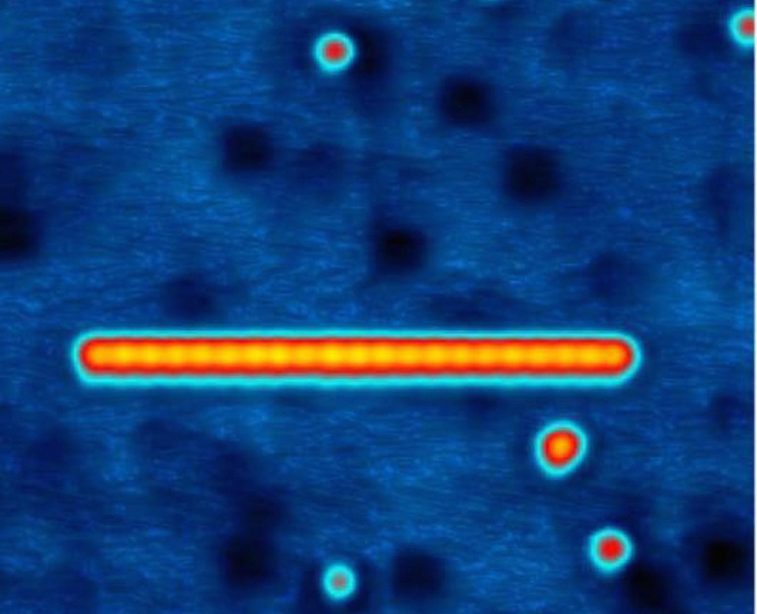 Image of a chain of 21 Manganese atoms on a superconducting material (Bi2Pd), built atom by atom using the tip of the STM