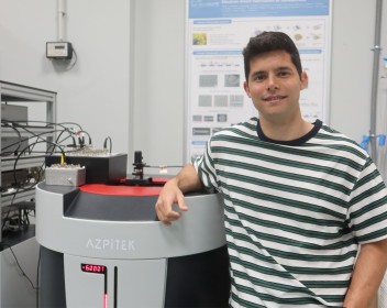 Manuel Suarez close to a PPMS at nanoGUNE 