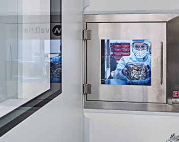 Image of one of 25 Graphenea's employees working in the cleanroom